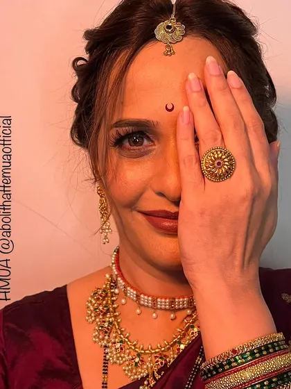 A creative shot for a Mangalagauri look, highlighting the traditional jewelry and the beautiful eye makeup.