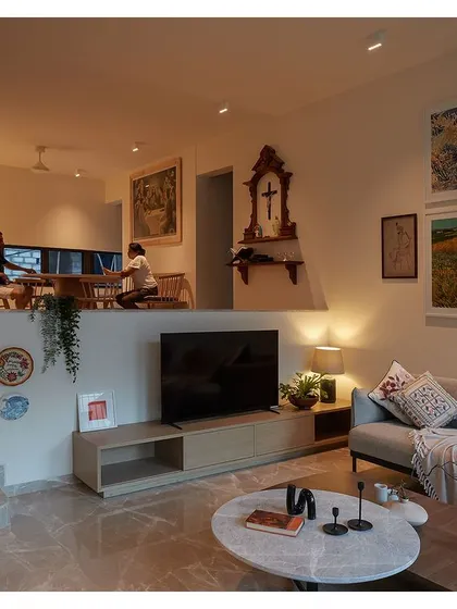 The same view at night, where warm artificial lighting creates a cozy and intimate atmosphere. The home transforms from a bright, airy space by day to a tranquil retreat by night.