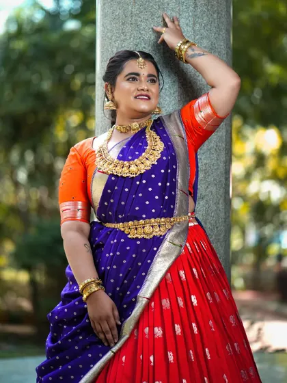 Another angle of the vibrant orange and blue half saree, a custom creation for the festive season.