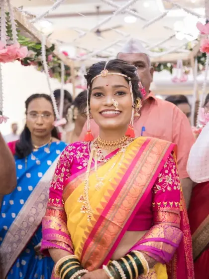 The bride's joyful smile as she walks towards the mandap, a beautiful moment of bridal entry.