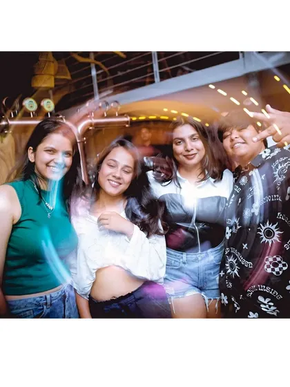 The dance floor is where the magic happens. Light trails and happy faces.