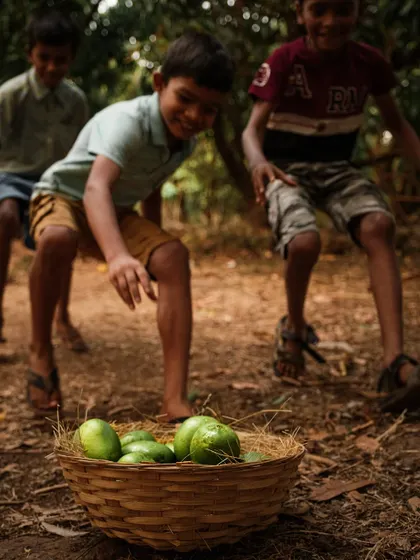 An action shot of children playfully running towards a basket of mangoes, capturing their excitement and energy.