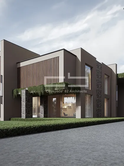This architectural masterpiece redefines opulence, combining a striking, dark-toned facade with lush surroundings for an unparalleled blend of style and comfort. The design plays with solid volumes and transparent surfaces to create a bold statement.