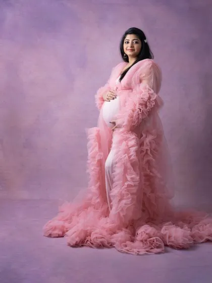 A dreamy and romantic maternity look. I used soft, glowing makeup to complement this beautiful ruffled pink gown, creating a fairytale-like portrait for the mom-to-be.