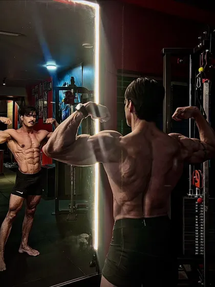 A slightly different angle of the mirror pose, emphasizing the importance of competing only with yourself to get better every day.
