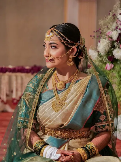 A traditional Coorgi bride look, complete with the unique saree drape and veil. I am experienced in various regional bridal styles.
