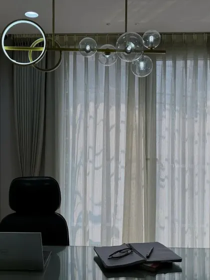 Another angle of the completed office, showing the elegant curtains and lighting that create a sophisticated atmosphere.