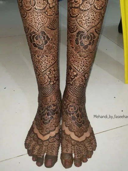Full coverage bridal legs, featuring dense floral and traditional patterns from toes to shin.