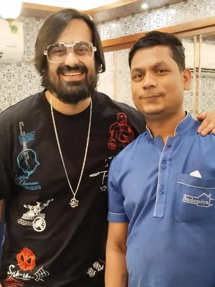 Ashish Chanchlani and Akash Dodeja posing with our staff during their visit.