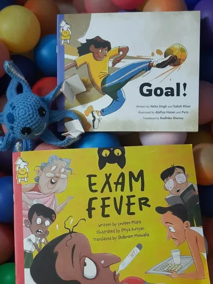 Our library mascot poses with the books for the "One Day One Story" event. These stories about girls in sports and mothers taking exams sparked wonderful conversations.