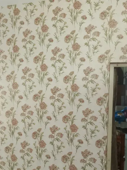 A classic floral wallpaper with a repeating botanical print. This timeless design works well in many different rooms.