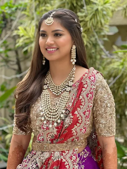 Another beautiful shot of this pre-wedding look. The half-up hairstyle with a braid is a perfect choice for an elegant and youthful vibe.