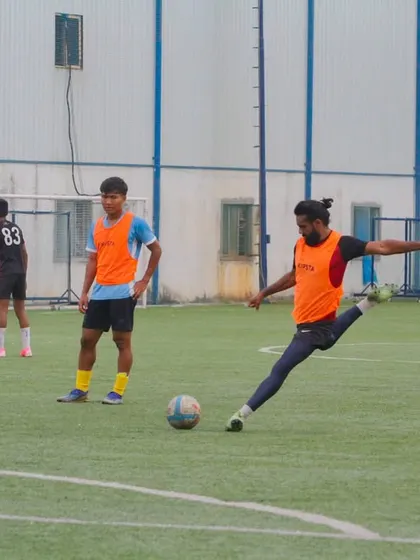 Power and precision in every kick. A player practices their shooting technique during a training session, focusing on generating force while maintaining accuracy.