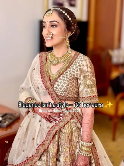 Elegance isn't a style, it's her aura. A stunning bride getting ready, her calm and composed demeanor radiating pure grace, complemented by her intricate mehendi.