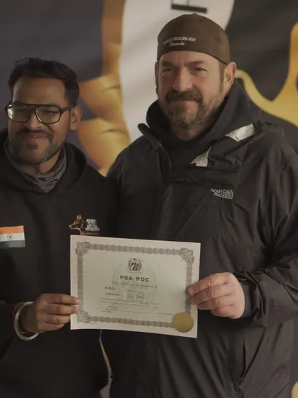 Results speak louder than words. Here I am receiving the PSA PDC certificate for my dog Angel, a testament to her hard work and the effectiveness of my training methods. I don't just train dogs, I produce certified, titled athletes.