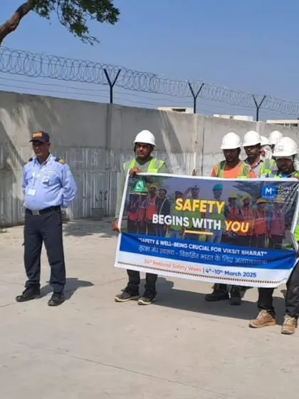 A team holds a "Safety Begins With You" banner. This message encapsulates our belief that a strong safety culture is built on individual responsibility and collective awareness.