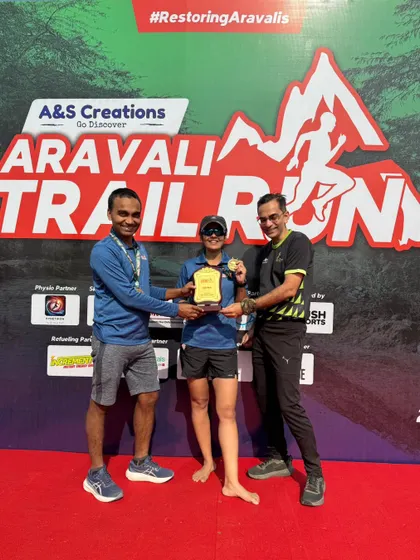 A winner receiving her trophy on stage. We ensure every winner gets their moment of recognition.