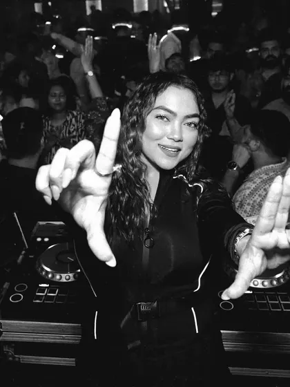 Connecting with the crowd from the DJ booth. This black and white shot captures the interaction and energy of the night.