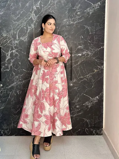A beautiful pink and white floral printed dress, styled with modern platform sandals. A great example of a casual, everyday ethnic look.