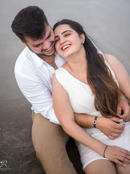 Even on an overcast, rainy day in Goa, the laughter doesn't stop. This cozy, happy moment from a beach session shows that beautiful photos aren't about perfect weather, but about the warmth and connection you share.