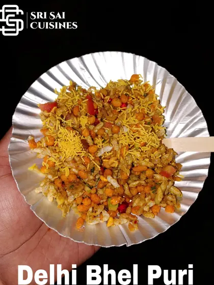 My Delhi Bhel Puri is a tangy and spicy mix of puffed rice, sev, onions, and chutneys. It's a light and flavorful snack that's perfect for any time during an event.