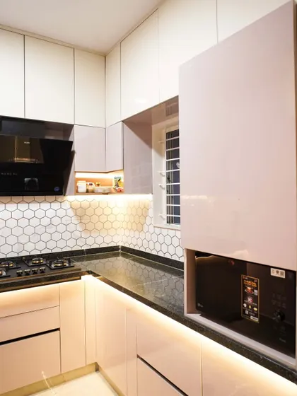 A closer look at the microwave unit, showing how it seamlessly integrates into the cabinetry. This type of custom solution is key to creating a clean and organized kitchen.