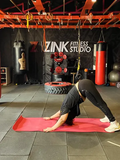 The downward dog pose is a staple in our warm-ups and cool-downs. It's a full-body stretch that lengthens the hamstrings, calves, and spine while also building strength in the shoulders.