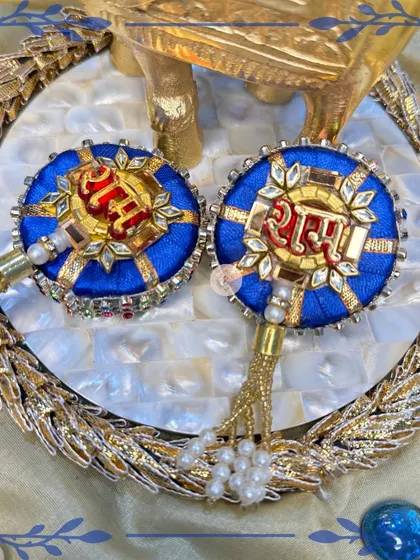 The royal blue "Ram Ram" hangings are a bold and beautiful choice, featuring intricate golden embroidery and pearl tassels.
