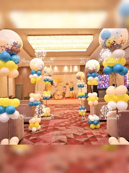 The venue for the "Around the Sun" party is decorated with celestial-themed balloon pillars, creating a cohesive and festive atmosphere.