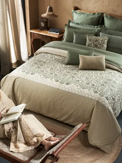 An overhead shot for the 'Sanskriti' collection, blending traditional attire with contemporary home decor. The composition creates a balanced and serene scene of leisure at home.