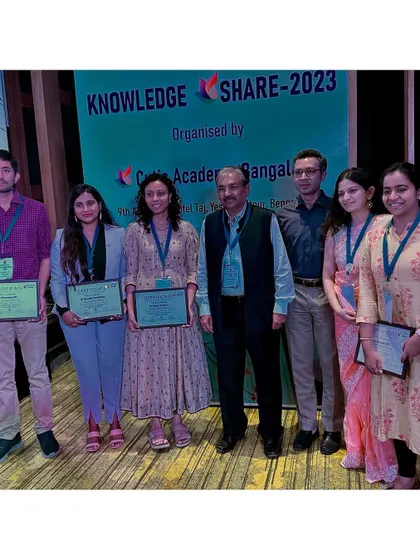 A group photo with fellow presenters and senior dermatologists after receiving our participation certificates at the conference.