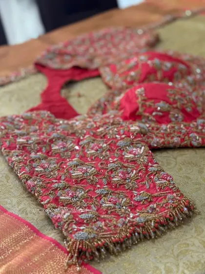 The full view of the red floral blouse.