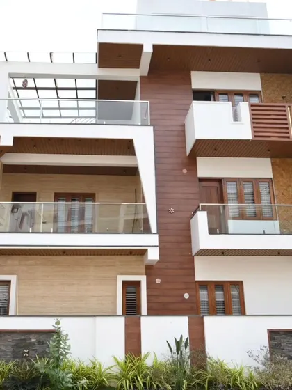 An exterior shot of a beautiful, modern villa that we fully automated, from security and networking to lighting and entertainment.