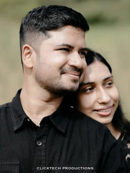 A close-up, intimate portrait of a couple, capturing a quiet and affectionate moment.