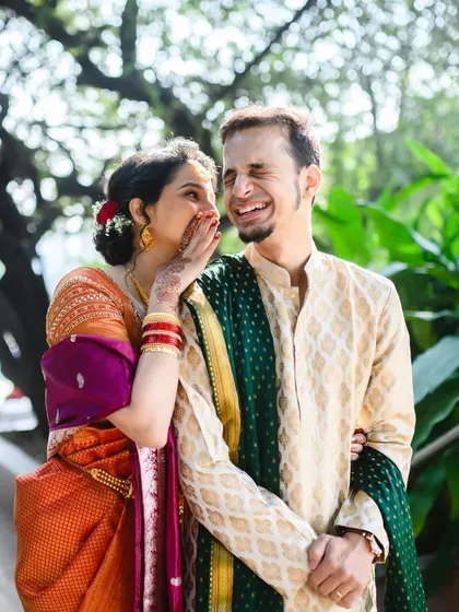 More laughter from Sanjana and Mihir. Her whispering in his ear and his reaction make for a wonderfully candid and memorable photo.