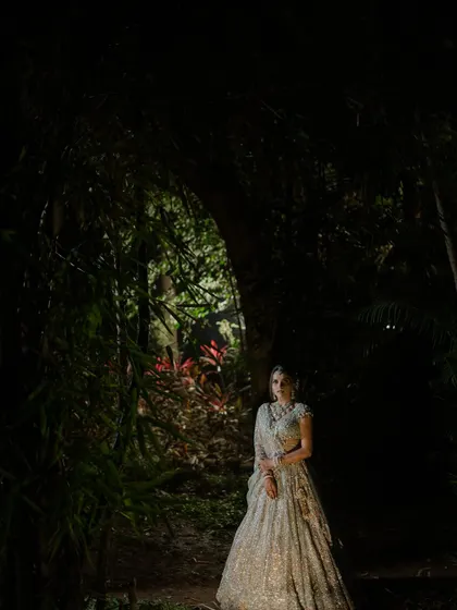 A bride illuminated in the darkness, like a character in a fairy tale. I love creating dramatic, cinematic portraits that tell a story and highlight the bride's magnificent presence.