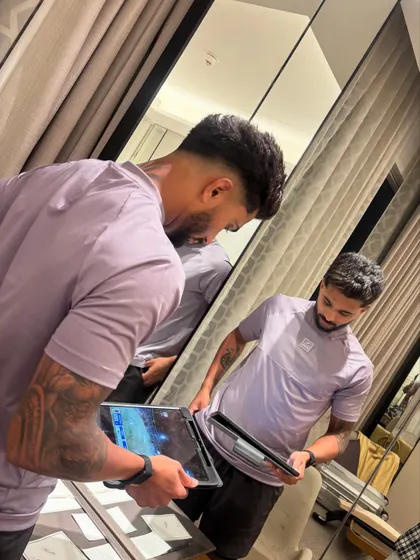 A mirror shot showing Nitish Kumar Reddy checking out his new fade.