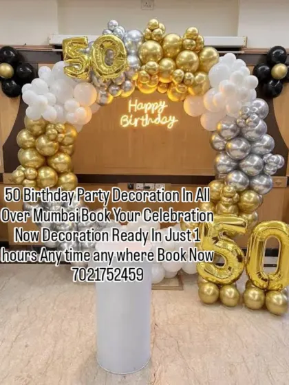Celebrating 50 years in style with this gold, silver, and black balloon arch. The large foil numbers and neon "Happy Birthday" sign make this a perfect setup for a milestone celebration.