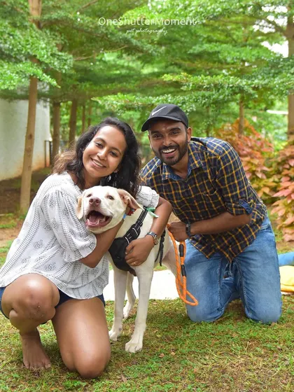 A big hug for a very good boy! This candid shot is full of laughter and love, showcasing the wonderful connection this family shares.