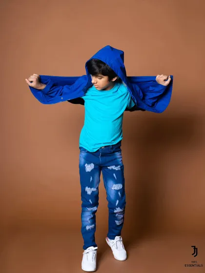 A playful and energetic shot from the same kids' fashion shoot. Capturing movement and fun is key to creating engaging content for children's brands.
