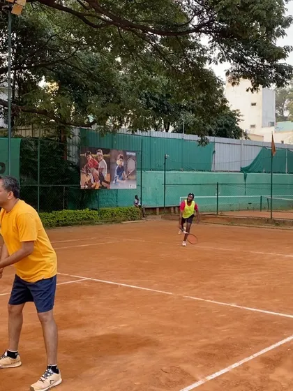 A doubles team in action during a TTPL event. You can see the ample space and well-maintained surroundings that make our courts ideal for tournaments.