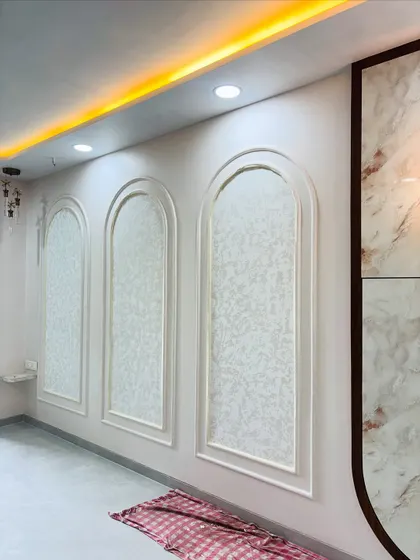 Another wall design, where the POP arches are filled with a subtle, patterned wallpaper, creating a sophisticated and classic look.