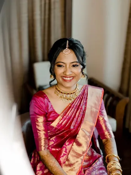 A happy bride is the most beautiful bride. This shot captures her radiant smile, with makeup that looks natural and fresh even in the bright daylight.