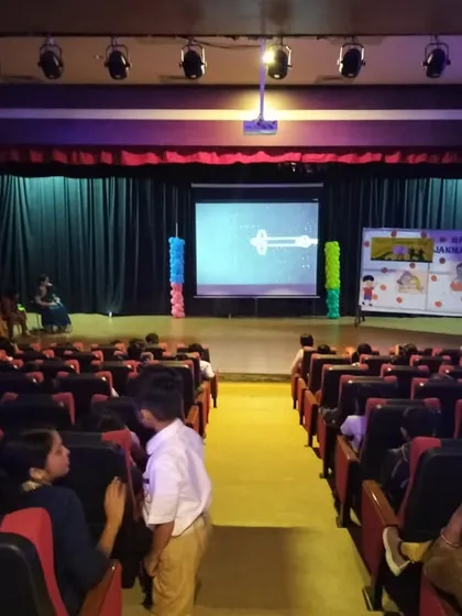 The audience of students watches a presentation about space exploration, a part of our engaging and educational National Space Day event.