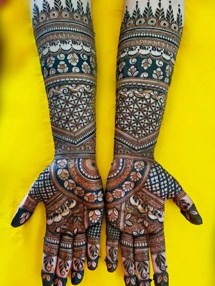A gorgeous full-coverage design with a dark, rich stain. The pattern uses geometric and floral motifs to create a dense and captivating look.