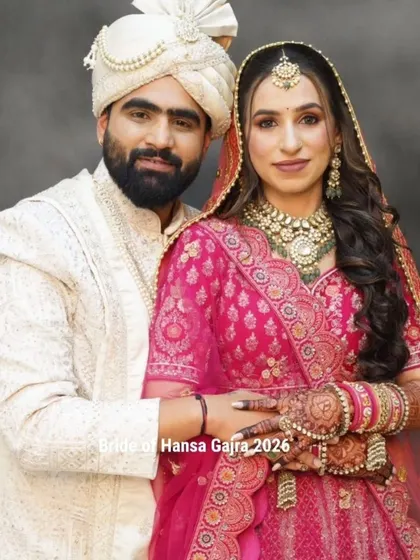 A beautiful portrait of the bride and groom. Her hands, decorated with intricate mehendi, gently rest on his, a symbol of their new life together.