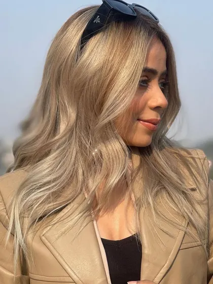 Going blonde is a statement. This look is a proud, confident, all-over blonde achieved with careful lightening and toning to create a beautiful, even, and healthy result.