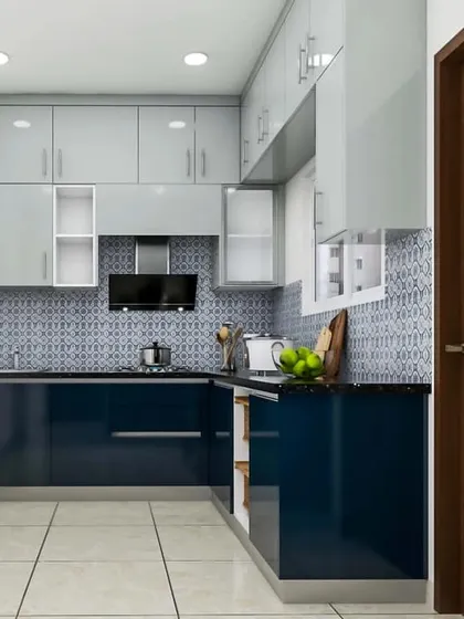 Perfect for a compact space, this L-shaped kitchen uses a bold navy blue for the lower cabinets and a light grey for the uppers. This two-tone approach makes the room feel larger while providing plenty of storage and a modern aesthetic.