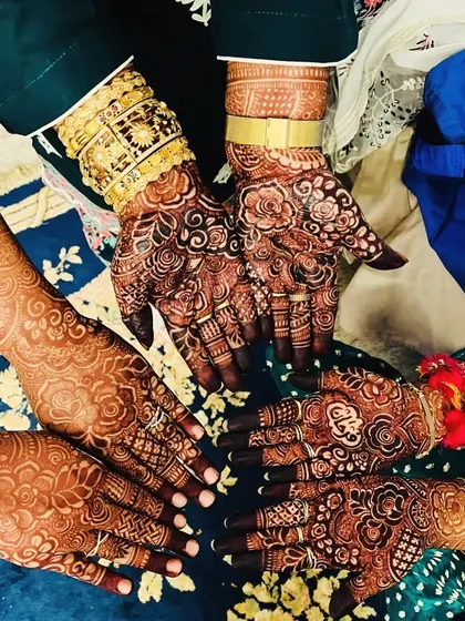 A group of hands showing off their beautiful, dark henna stains. It's so wonderful to see everyone happy with their results.