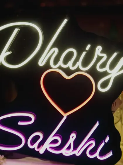 A personalized neon sign with the couple's names adds a modern and fun touch to the engagement party decor. It also serves as a great photo opportunity for the couple and their guests.